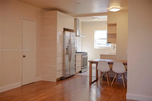 a view of a livingroom with furniture and hardwood floor