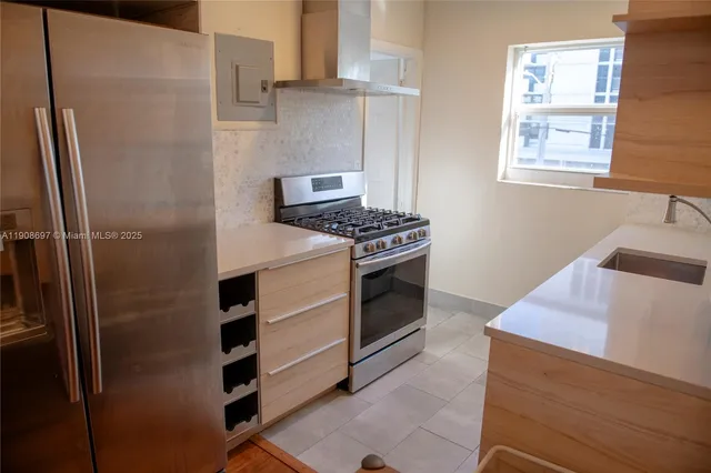a kitchen with a stove and a refrigerator