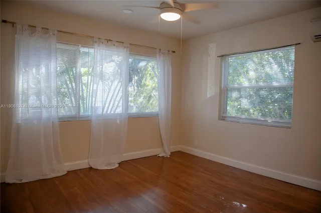 a view of a backyard with sitting area