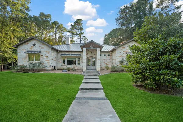 a front view of a house with garden