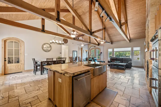 a view of a patio with table and chairs