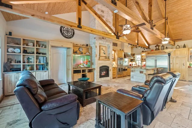 a view of a livingroom with furniture and a fireplace