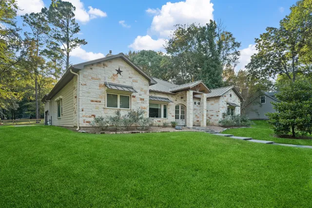 a front view of house with yard and green space