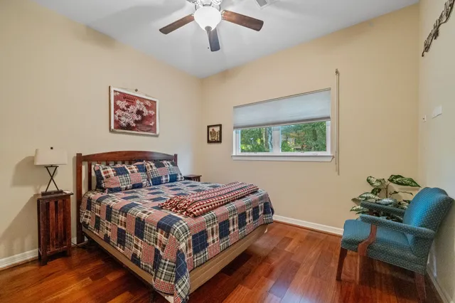 a bedroom with a bed and a table in it