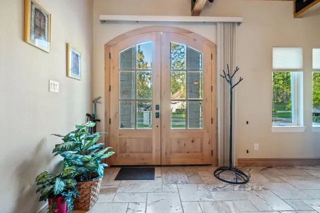 a view of a entryway door of the room