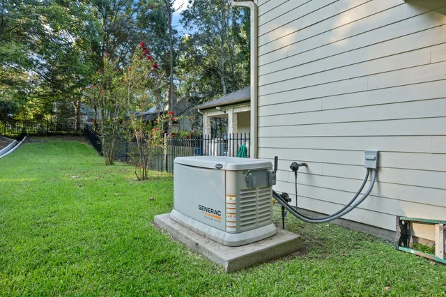 a view of a chairs in backyard of house