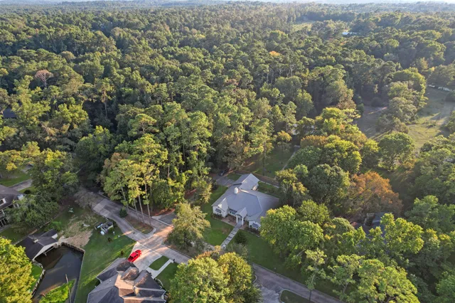 an aerial view of a houses with yard