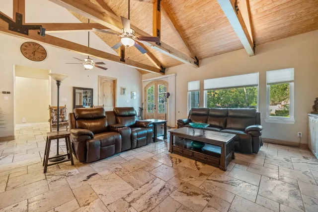 a living room with furniture a window and a table