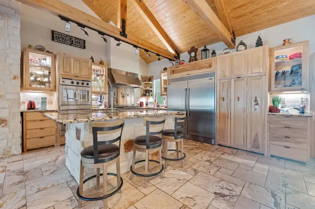 a dining room with furniture and a chandelier