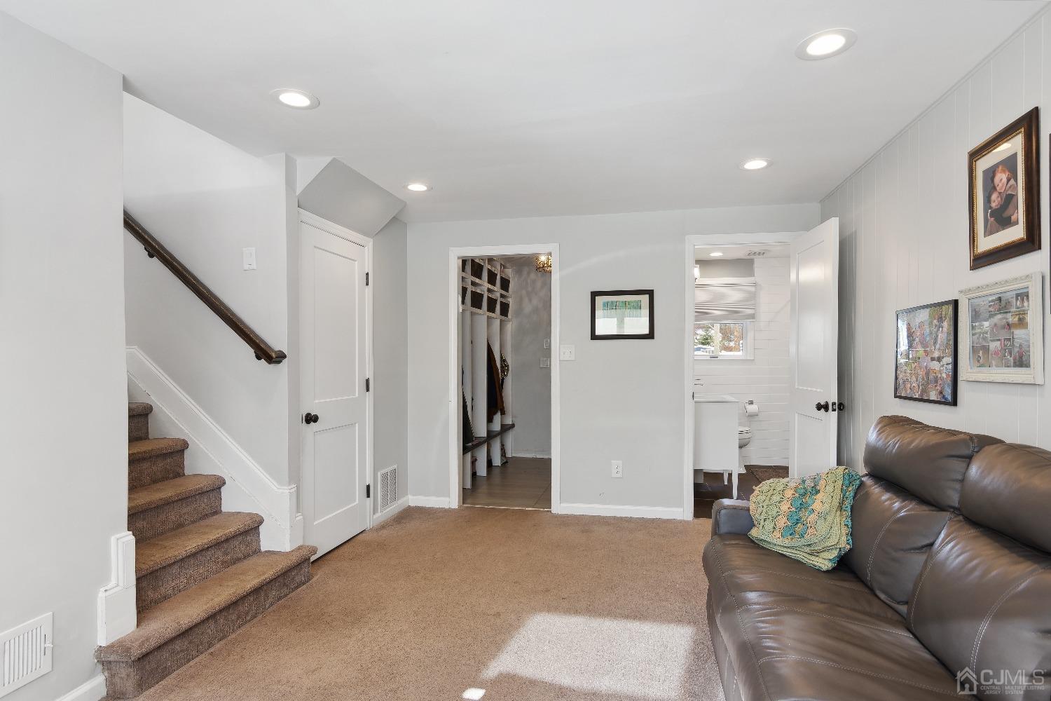 6 Barlow Road Edison, NJ 08817 - Photo 14 of 44 a living room with furniture and stairs