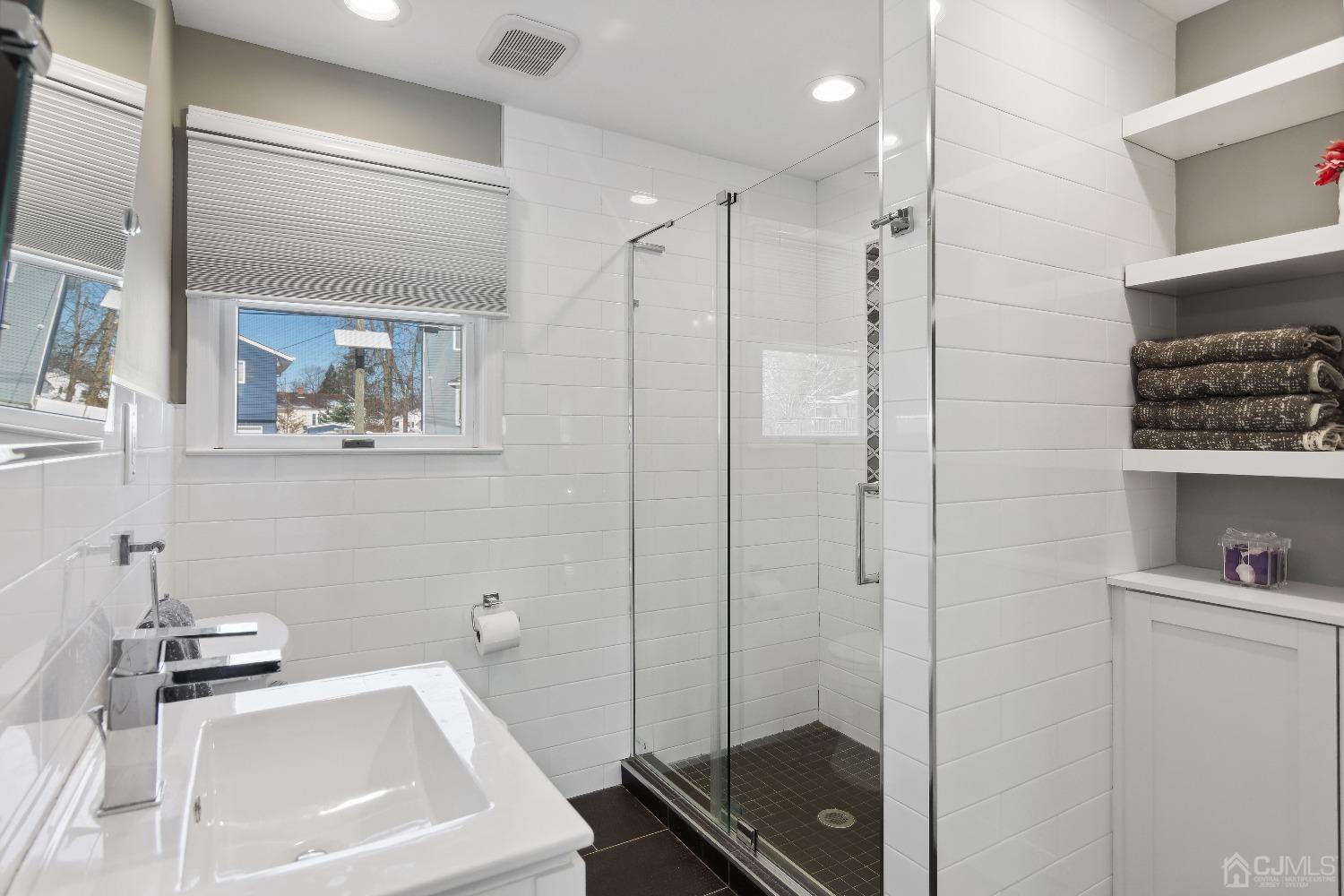 6 Barlow Road Edison, NJ 08817 - Photo 15 of 44 a bathroom with a bathtub and a sink