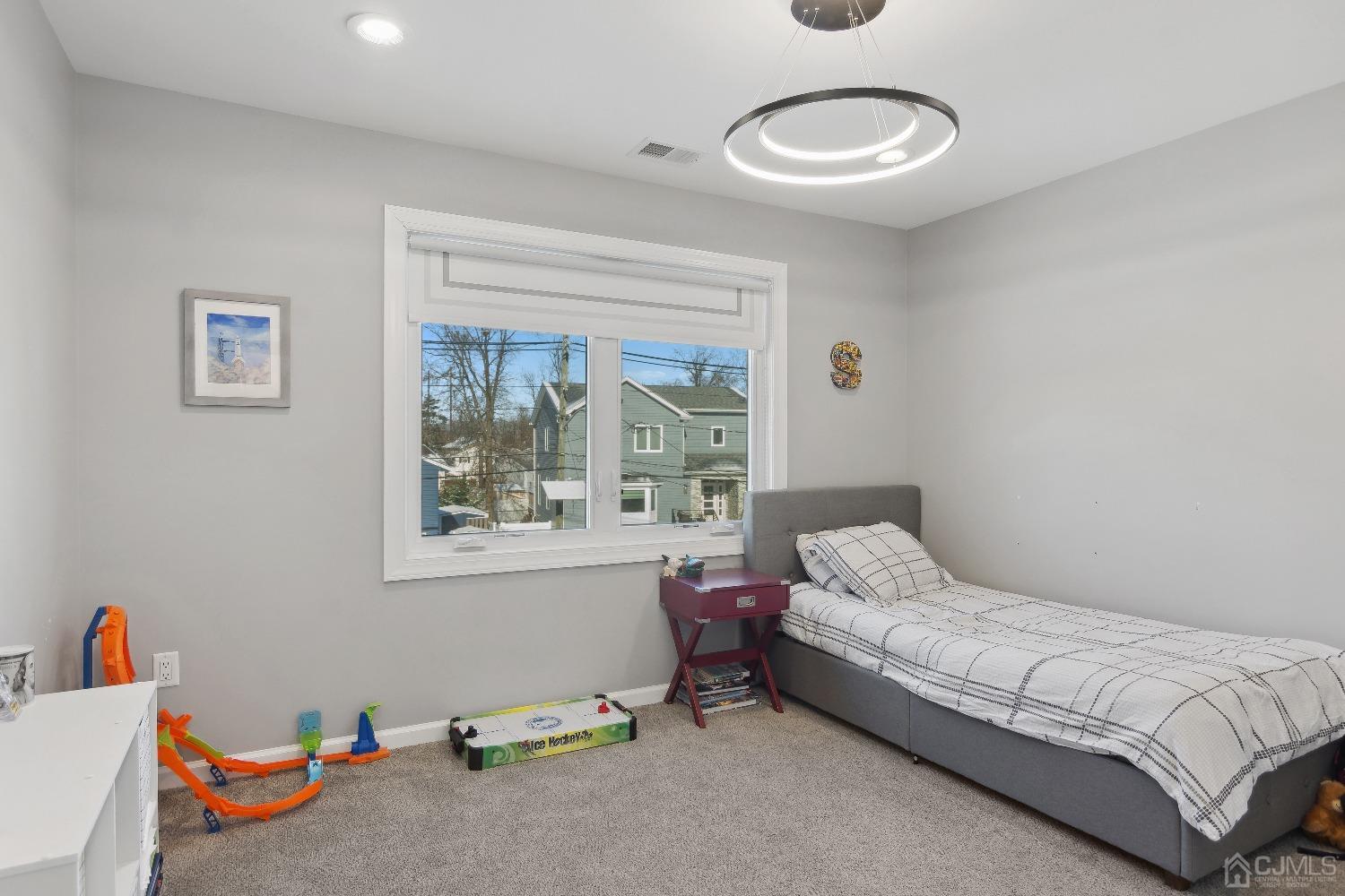 6 Barlow Road Edison, NJ 08817 - Photo 24 of 44 a bedroom with a bed and a window