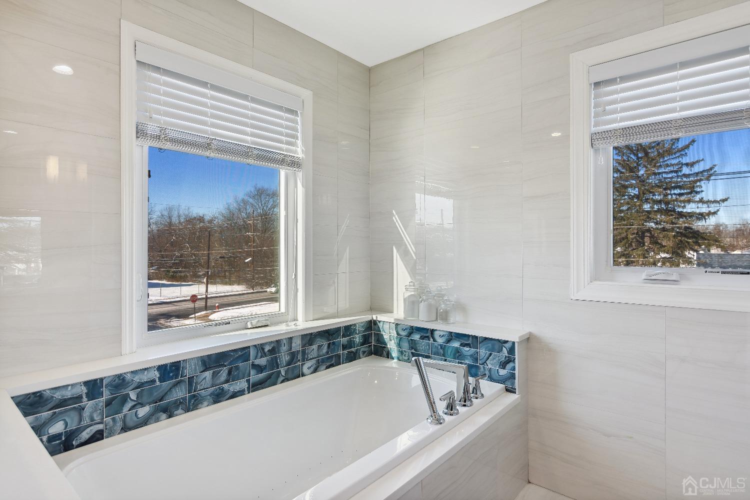 6 Barlow Road Edison, NJ 08817 - Photo 30 of 44 a bathroom with a bathtub and a window