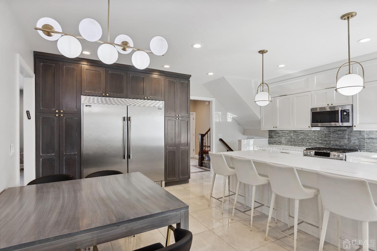 6 Barlow Road Edison, NJ 08817 - Photo 5 of 44 a kitchen with a table and chairs in it