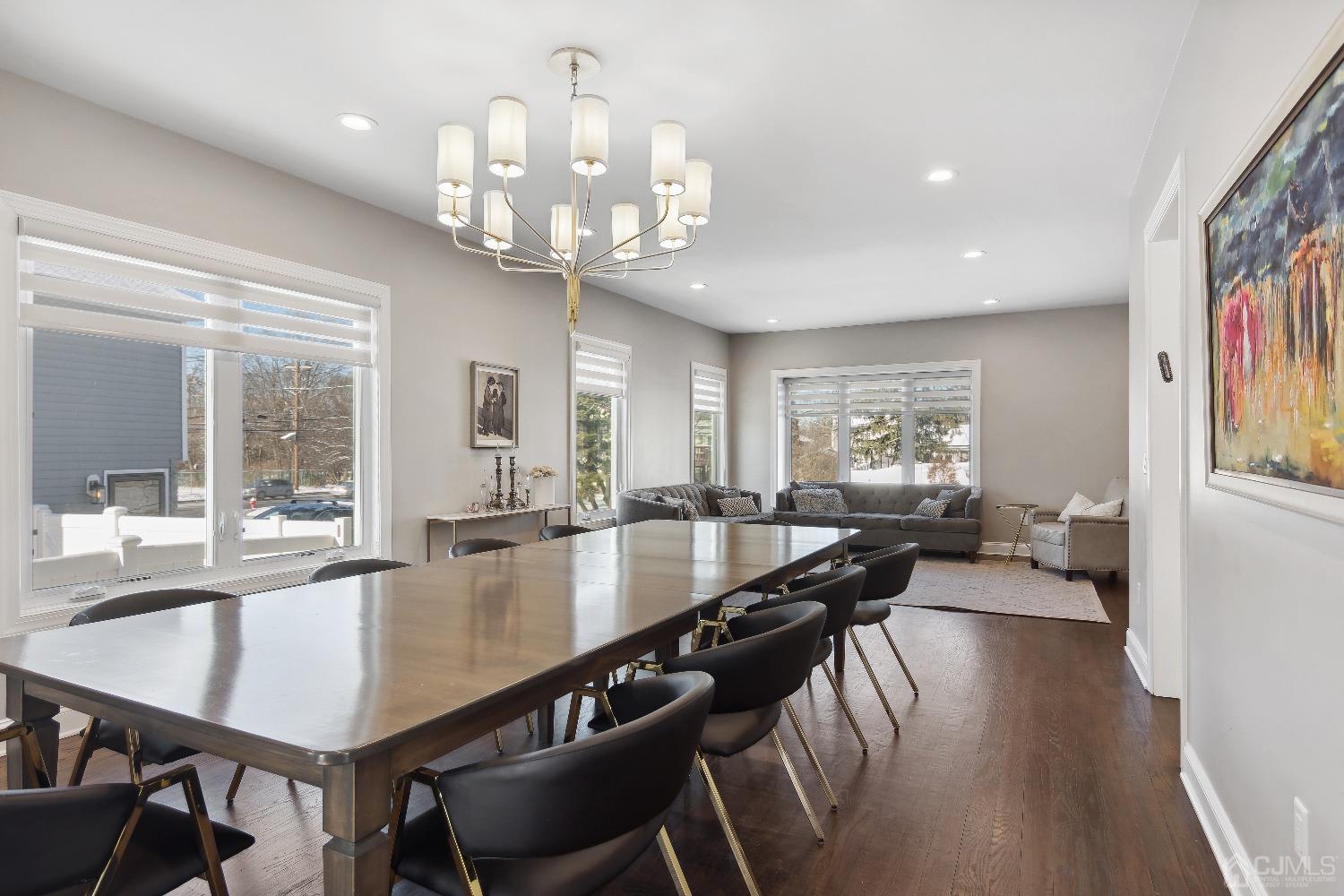 6 Barlow Road Edison, NJ 08817 - Photo 8 of 44 a view of a dining room and livingroom with furniture wooden floor a chandelier