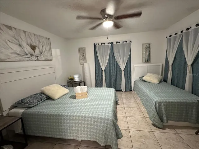 a bedroom with a bed and a couch