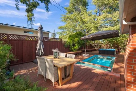 a view of yard with patio