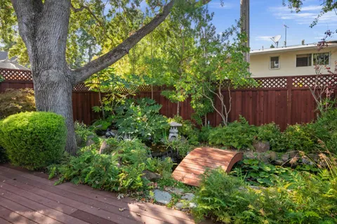 a view of a backyard with garden