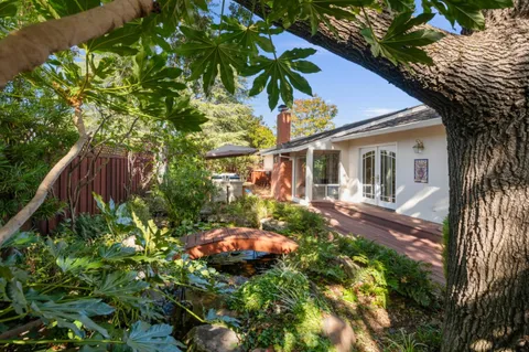 a backyard of a house with lots of green space