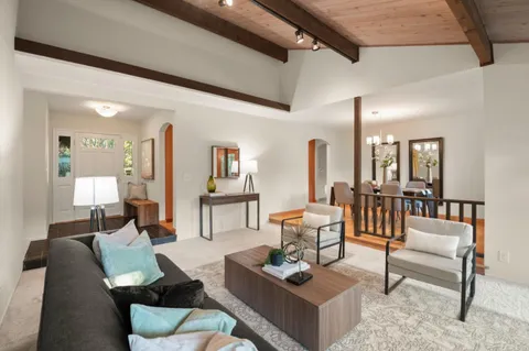 a living room with furniture and a table