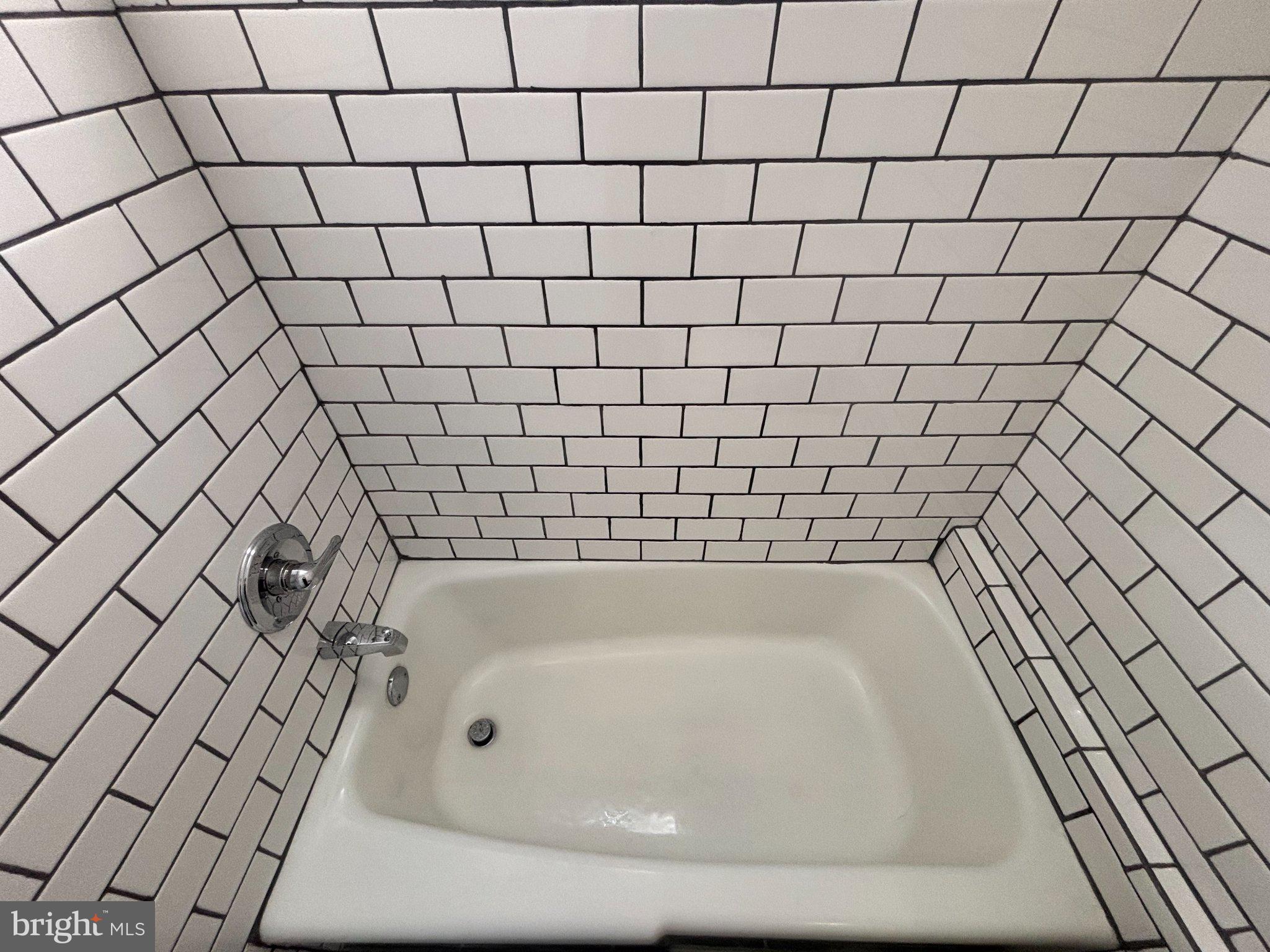 140 East Sterner Street Philadelphia, PA 19134 - Photo 3 of 11 Chic tiled corner bathtub retreat.