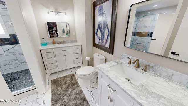 a bathroom with a sink a vanity and a mirror