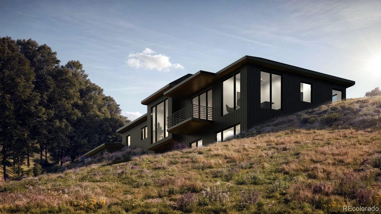 799 Clear Creek Road Evergreen, CO 80439 - Photo 3 of 26 a front view of a house with a yard