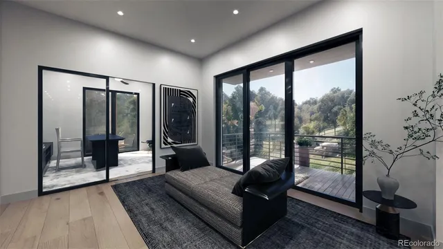 a living room with glass top table and a large window