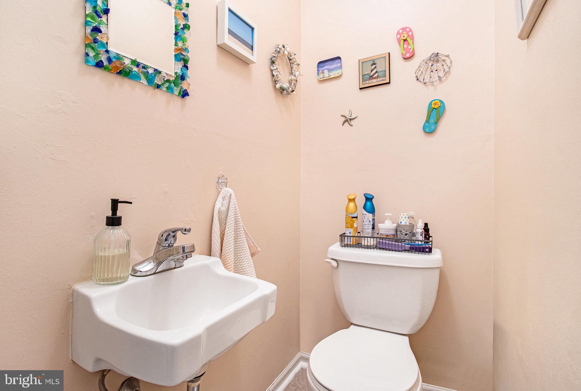 816 Lawler Street Philadelphia, PA 19116 - Photo 12 of 47 a bathroom with a toilet sink and mirror