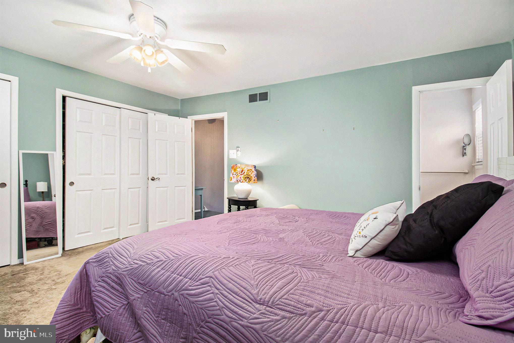 816 Lawler Street Philadelphia, PA 19116 - Photo 15 of 47 a bedroom with a bed and a chandelier