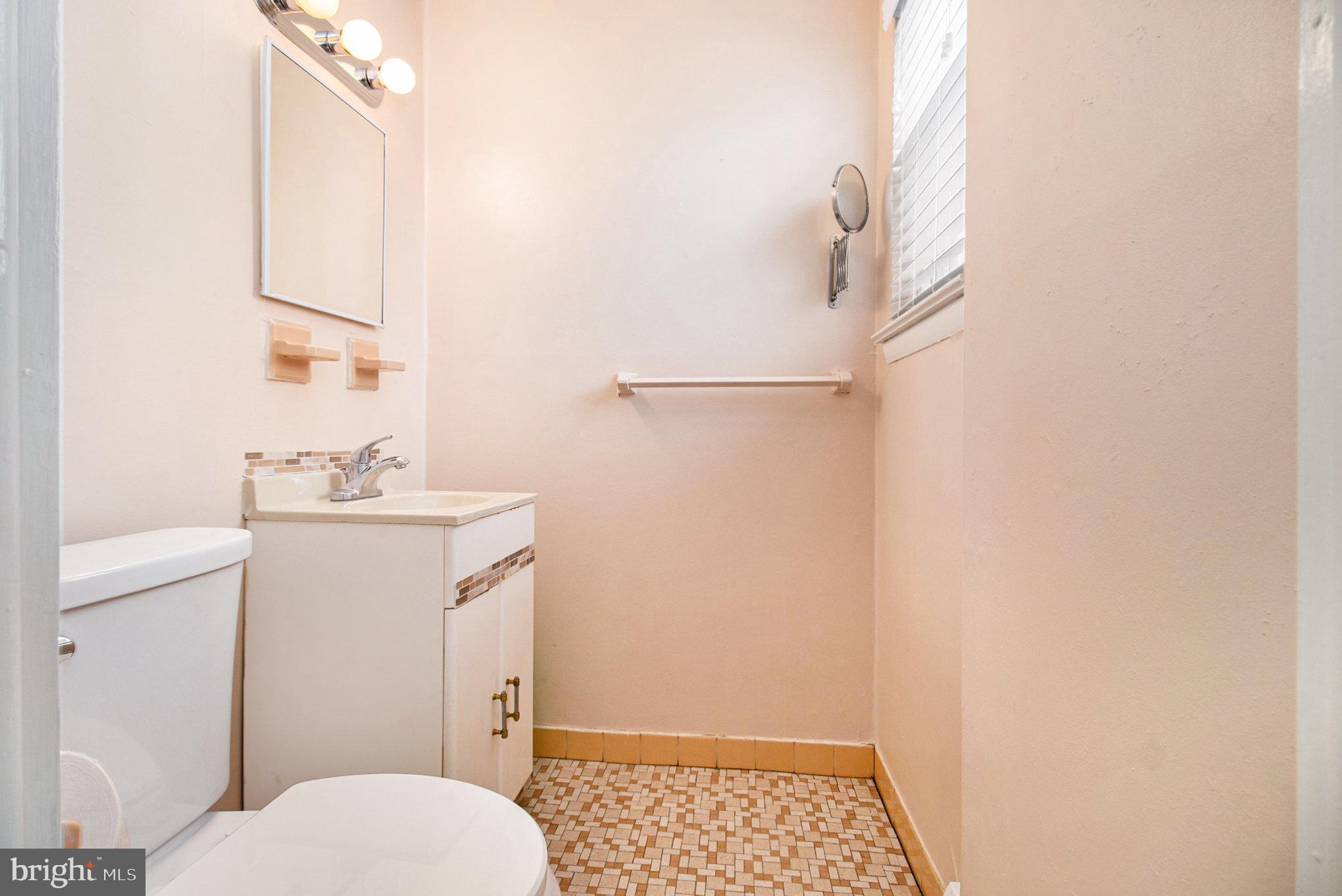 816 Lawler Street Philadelphia, PA 19116 - Photo 17 of 47 a bathroom with a sink toilet and shower