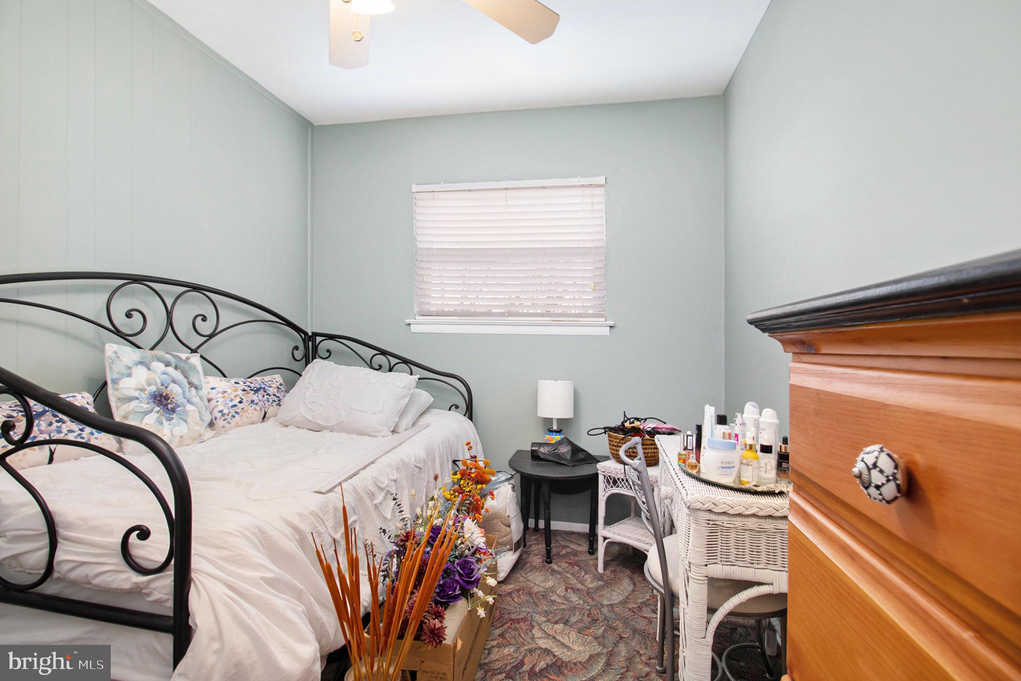 816 Lawler Street Philadelphia, PA 19116 - Photo 19 of 47 a bedroom with a bed and a table in it
