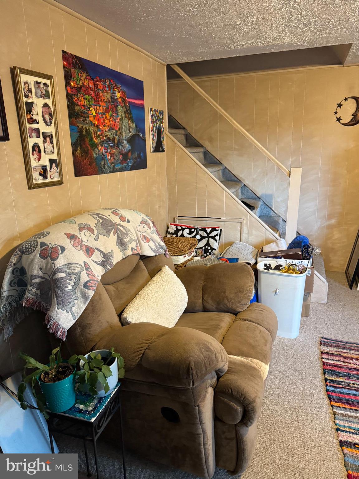 816 Lawler Street Philadelphia, PA 19116 - Photo 27 of 47 a living room with furniture and a painting on the wall