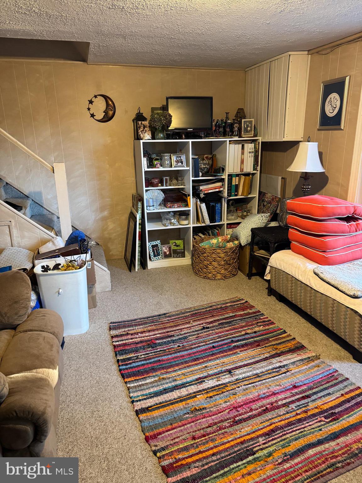 816 Lawler Street Philadelphia, PA 19116 - Photo 28 of 47 a living room with furniture and a book shelf