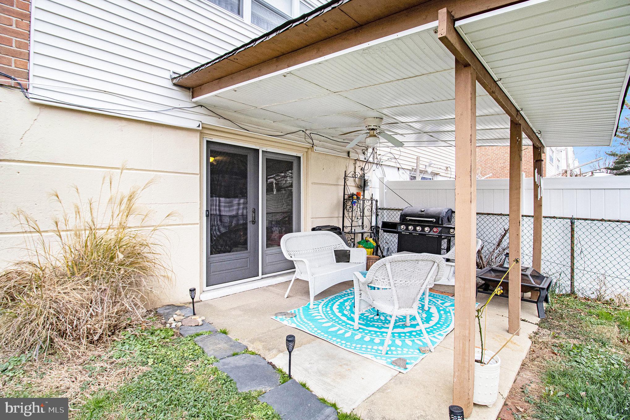816 Lawler Street Philadelphia, PA 19116 - Photo 32 of 47 a view of a patio with table and chairs and potted plants