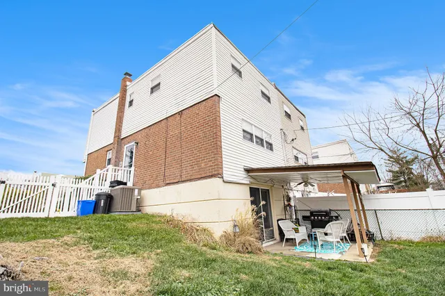 a view of a tall building with a yard