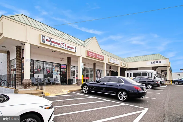a view of a cars park in front of a building