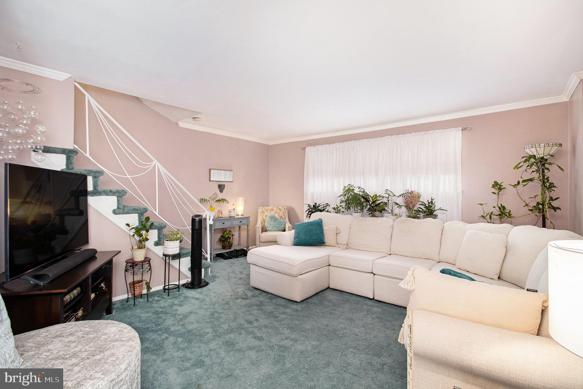 816 Lawler Street Philadelphia, PA 19116 - Photo 6 of 47 a living room with furniture and a flat screen tv