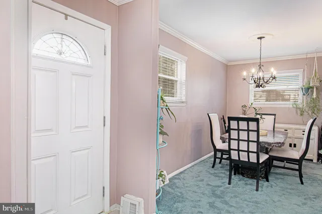 a view of a room with furniture and window