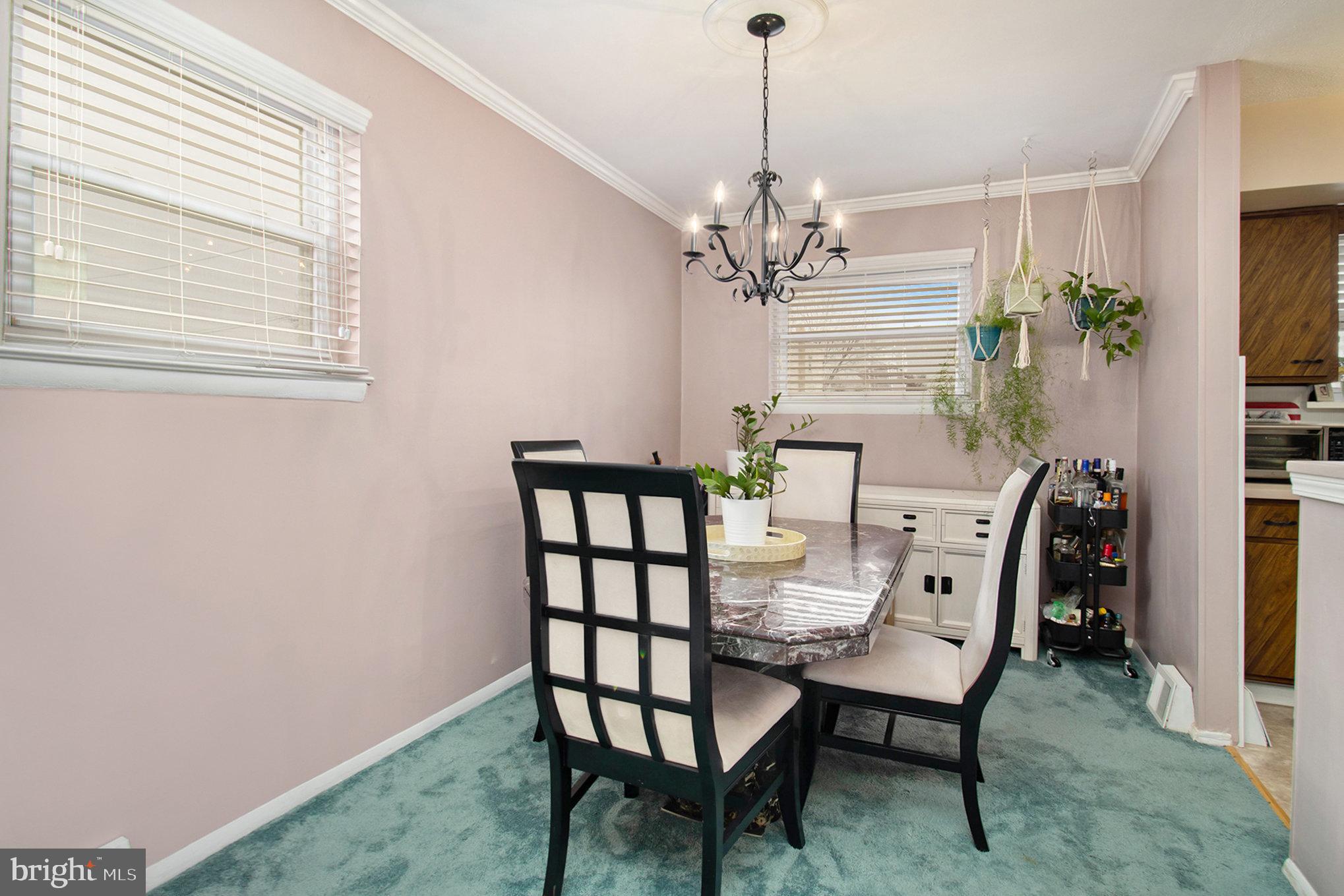 816 Lawler Street Philadelphia, PA 19116 - Photo 9 of 47 a view of a dining room with furniture and chandelier