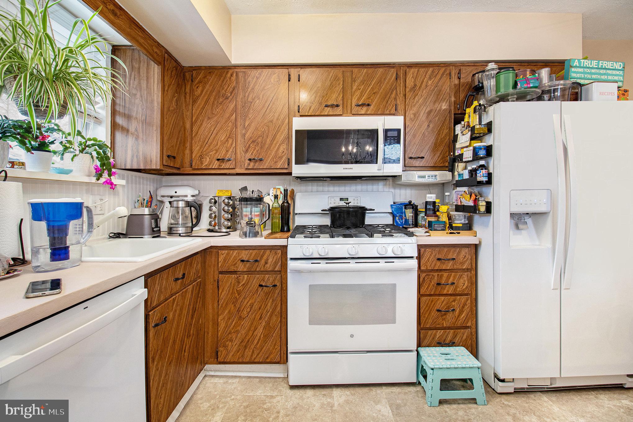 816 Lawler Street Philadelphia, PA 19116 - Photo 10 of 47 a kitchen with stainless steel appliances granite countertop a refrigerator sink and cabinets