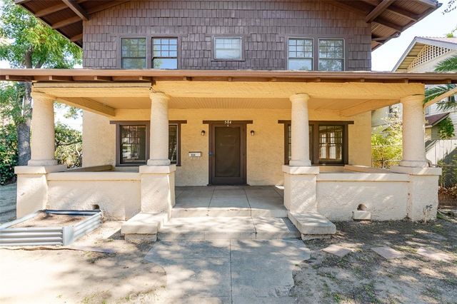 a view of a living room and entry way