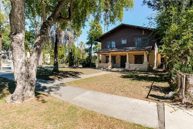 a house with trees in the background
