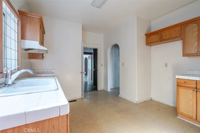 a bedroom with a bed and a sink