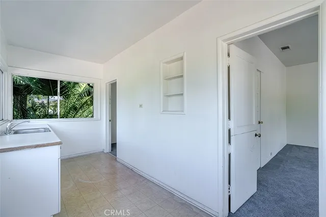 a view of hallway with washer and dryer