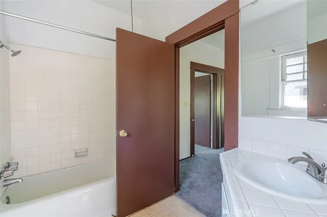 a bathroom with a bathtub and a sink