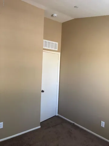 an empty room with wooden floor