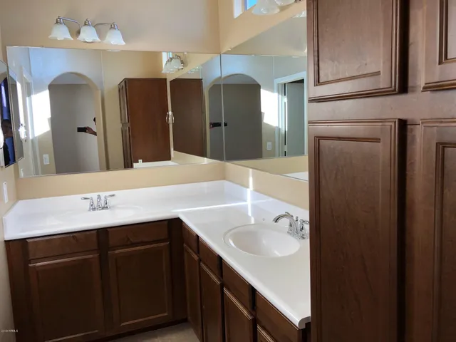 a bathroom with a tub and toilet