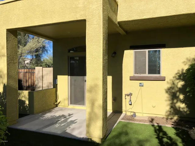 a view of a swimming pool with an outdoor space and seating area