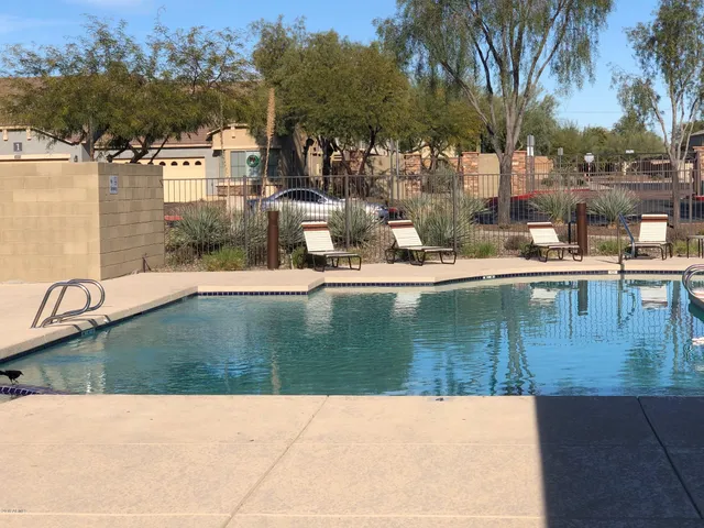 a view of swimming pool with a yard